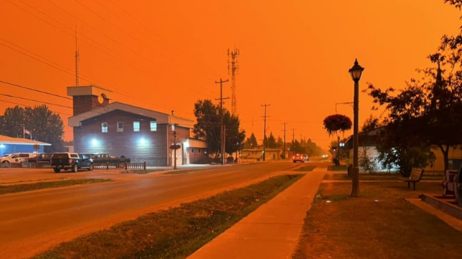 Thousands flee wildfires in Canada's far north