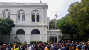 Sri Lanka leader flees as protesters storm home