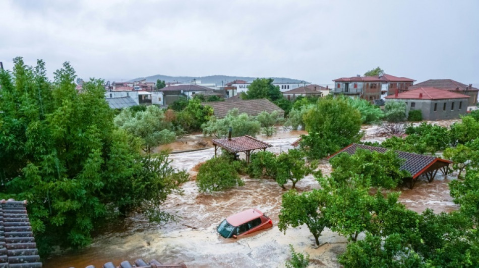 Torrential rains kill one in Greece after wildfires