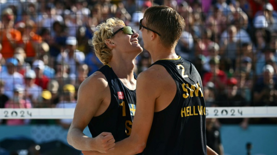 Women's champions knocked out of Olympic beach volleyball in nail-biting finish