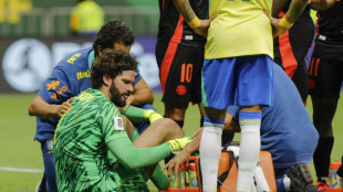 Liverpool's Alisson returns early from Brazil duty with suspected concussion