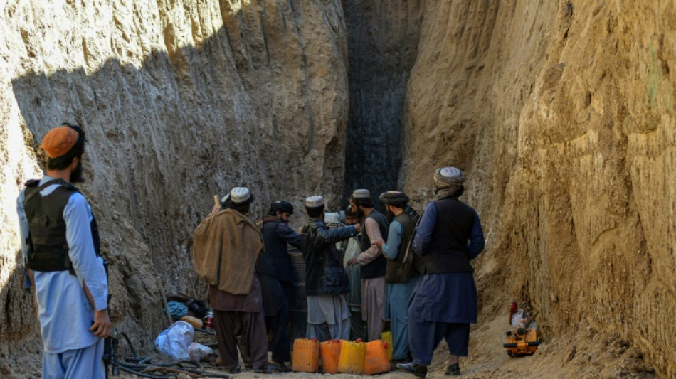 Rescuers near boy trapped in Afghan well, but rock blocks progress