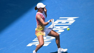 Swiatek battles past Siniakova into Australian Open second round