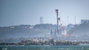 Fukushima operator says released water samples within safe limits