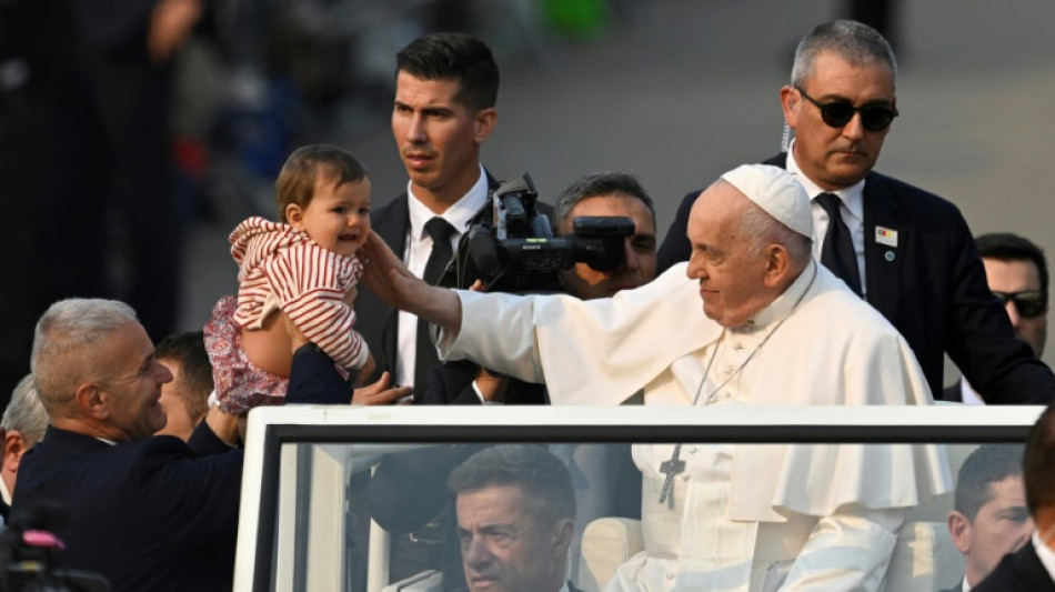 Tens of thousands greet pope at  Portugal's famed Fatima shrine 