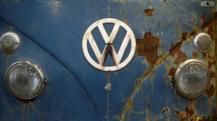 Volkswagen sees 'painful' cost cuts ahead as profit plunges