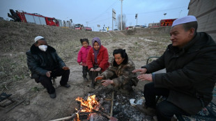 Rescuers dig in freezing cold after China quake kills 131