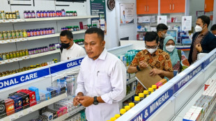 Indonesia revokes licences of drug firms over syrups linked to child deaths