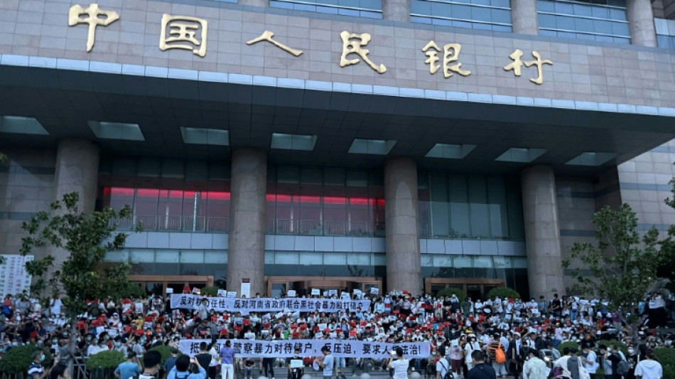 China arrests hundreds over banking scandal that sparked rare protests