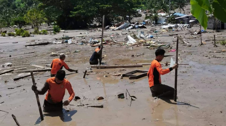 Rescuers search for bodies as Philippines storm death toll hits 98