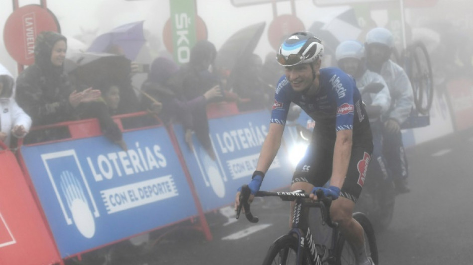 Rookie Evenepoel soars through fog into Vuelta lead