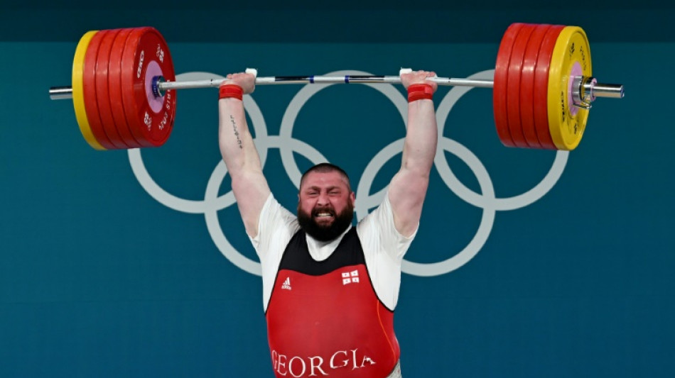 Talakhadze stays strong to retain weightlifting title